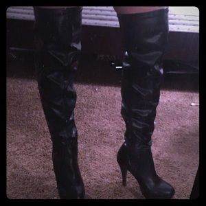 Black thigh high leather boots